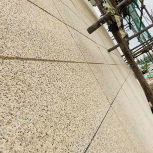 山南 黄金麻花岗岩荔枝面外墙干挂石材效果示例